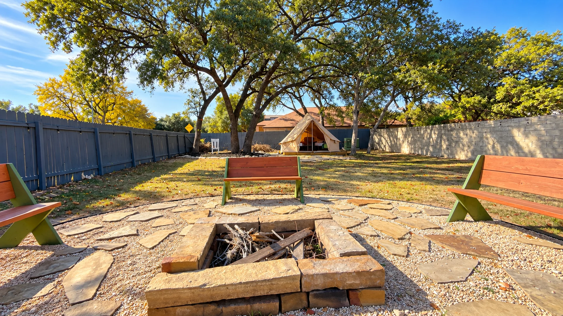 Private backyard fire pit and glamping area at Glampstead Retreat