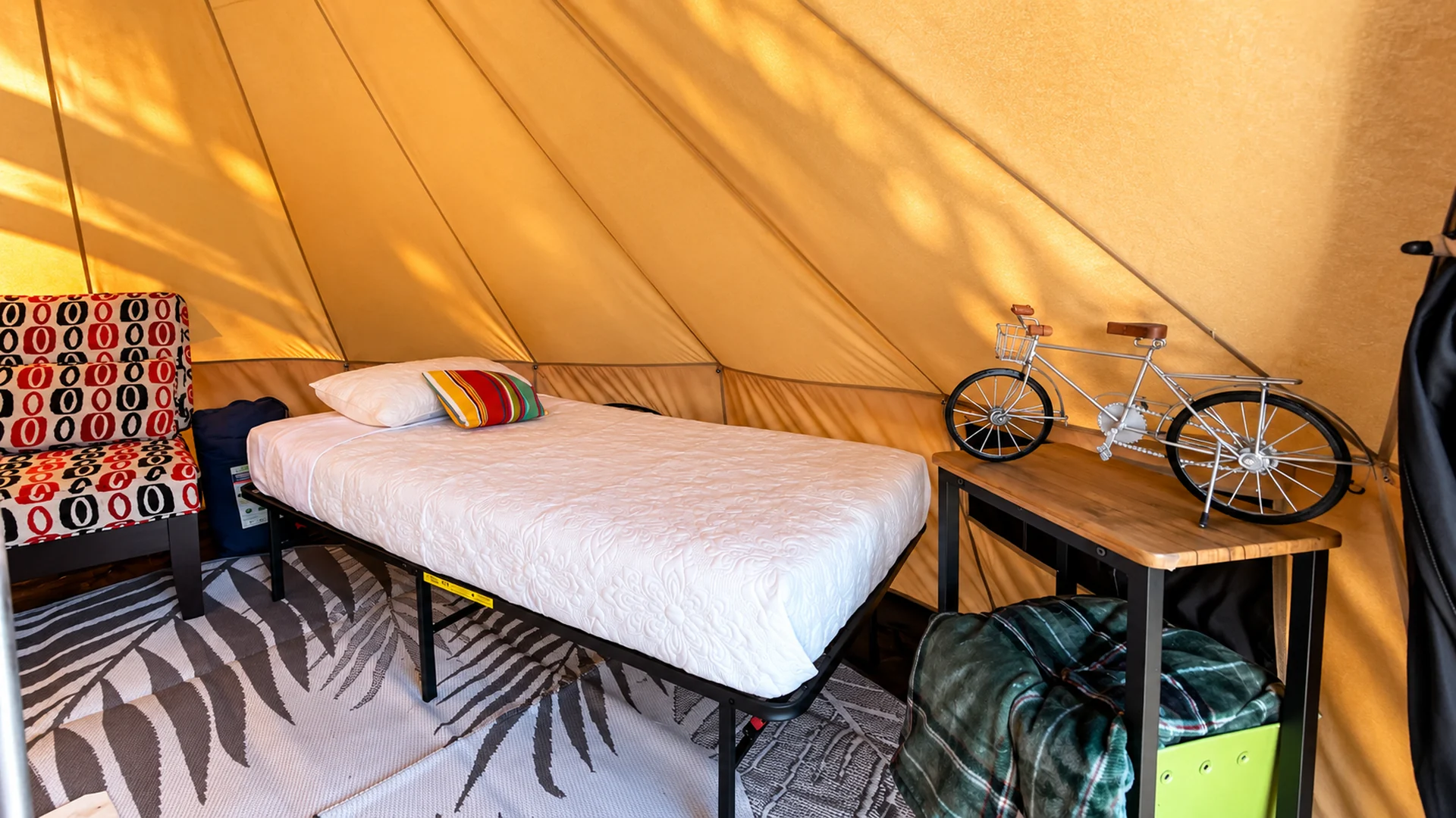 Furnished private glamping tent bedroom at Glampstead Retreat