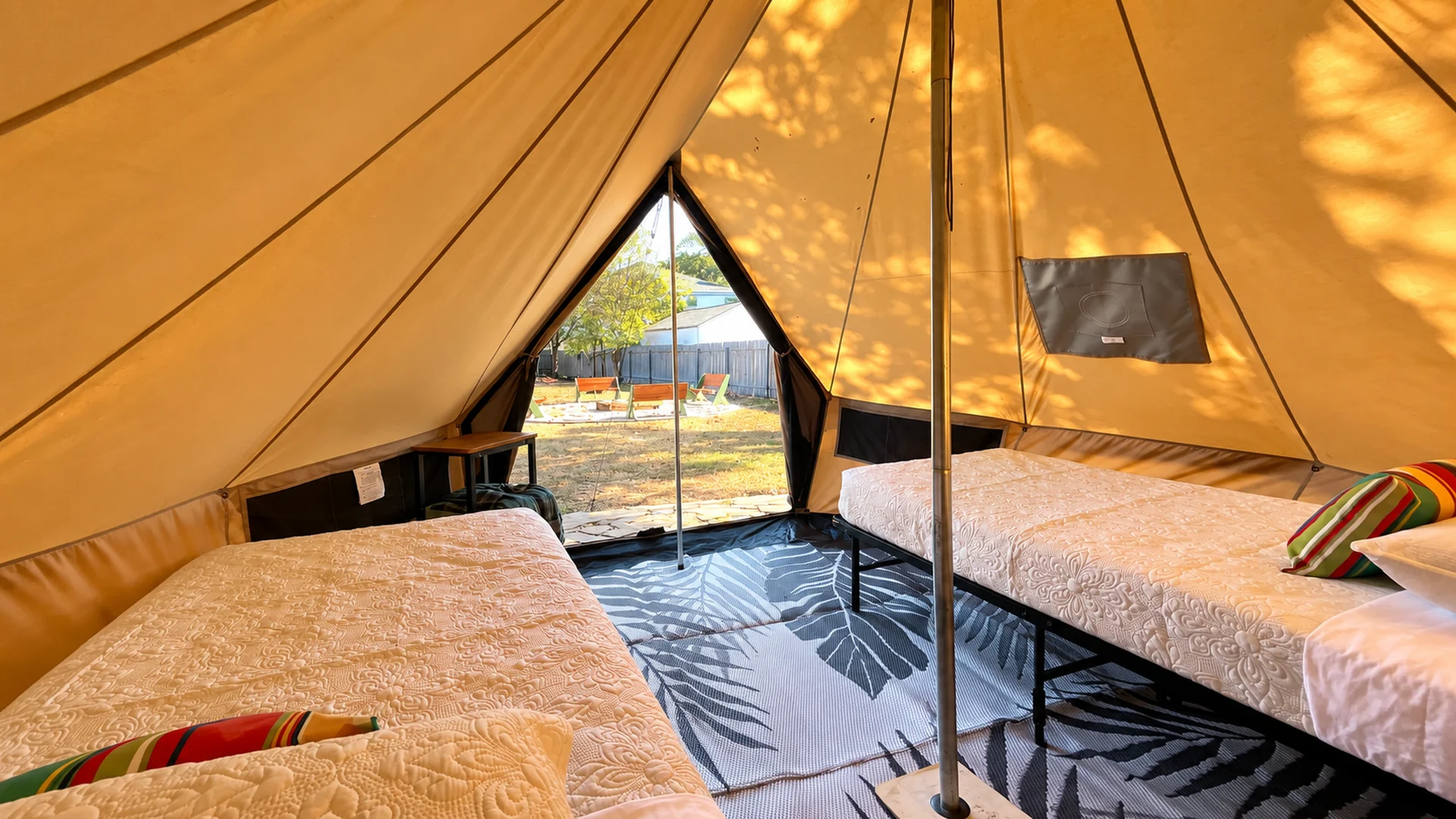 Private furnished glamping tent with two single beds at Glampstead Retreat