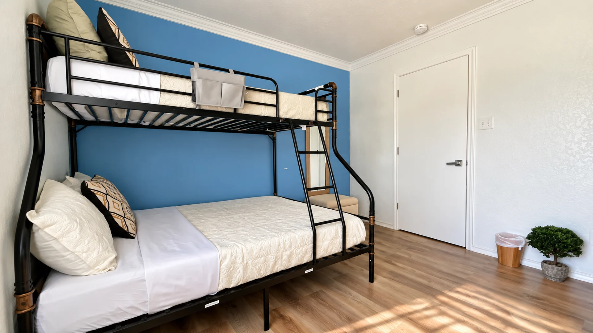 Bedroom with one double and three single beds at Glampstead Retreat